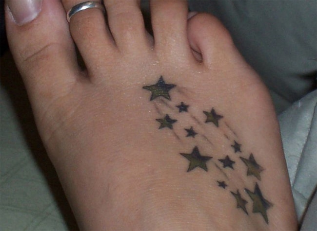 Little Black Star Tattoo Trend on Foot
