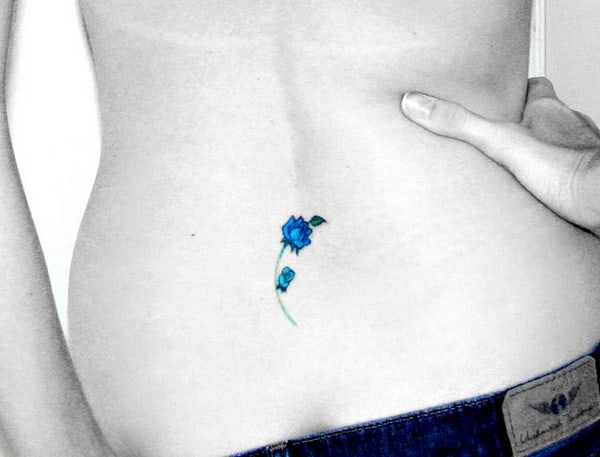 Very Small Blue Rose Tattoo on Lower Back