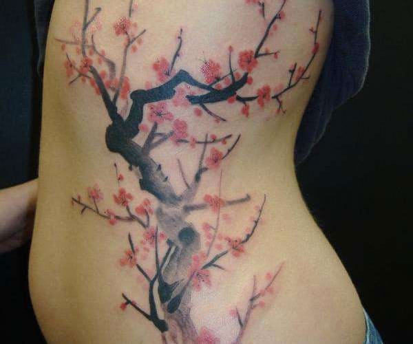 Elegant Japanese Cherry Blossom Tattoo for Rib