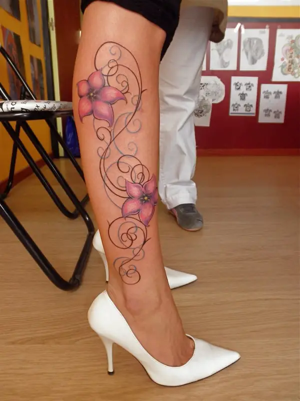 stylish-lily-tattoo-designs-on-leg-with-white-heel-shoes
