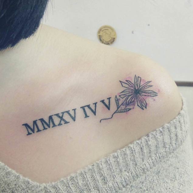 great-new-year-roman-numeral-tattoo-on-front-shoulder