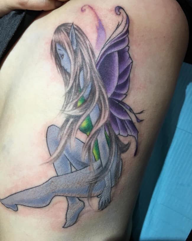 charming-side-rib-fairy-tattoo-in-blue-color