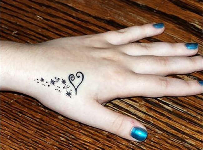 ladies-love-heart-and-stars-tattoos-on-back-hand
