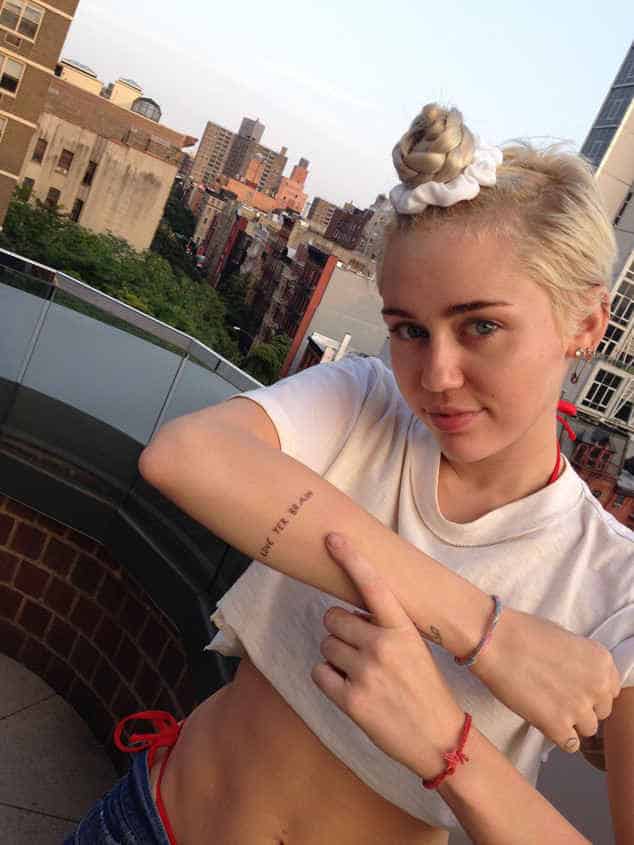 miley-cyrus-arm-typography-tattoos-pictures