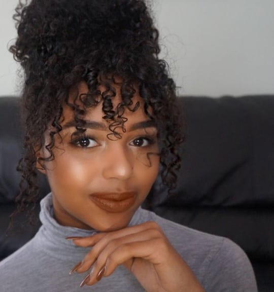 Curly Top Knot with Long Bangs for Black Women