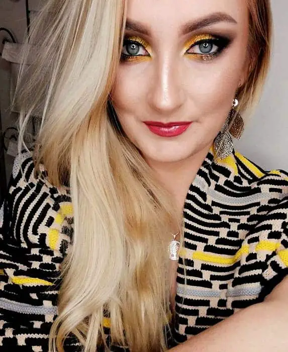 women with gold smokey eye makeup